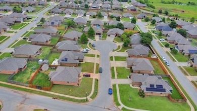 Aerial overview of property's location with nearby suburban area