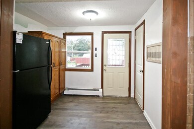 Kitchen area with pantry storage.
