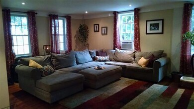 Large living room with wood stove