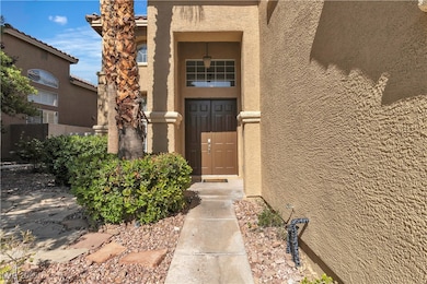 Property entrance featuring stucco siding