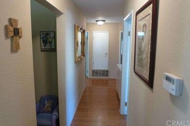Hallway outside family room leading to the bedroom
