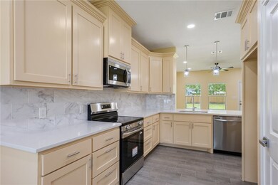 Kitchen featuring stainless steel appliances, crea