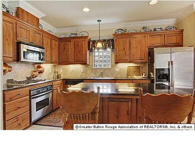 Kitchen with slab granite and stainless appliances