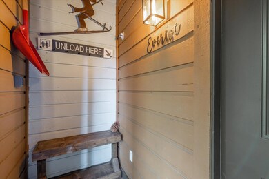 A storm door protects this enclosed entry, perfect