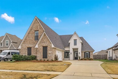 View of front of home featuring a front lawn and c