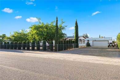 View of front facade featuring a garage