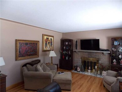 Living Room. Stone fireplace is wood burning.  Bea