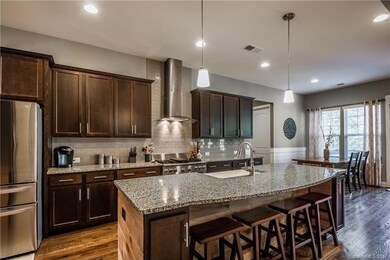 Huge island and perfect breakfast nook design