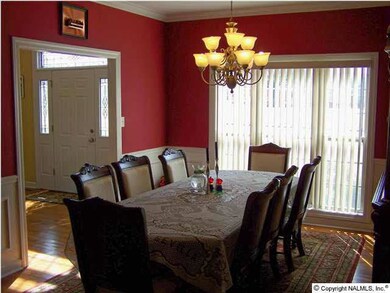 THE FORMAL DINING ROOM HAS WOOD FLOORS, SMOOTH CEILING, CROWN MOLDING, AND PLENTY OF ROOM FOR ENTERTAINING.