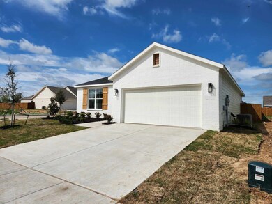 Ranch-style house featuring a garage