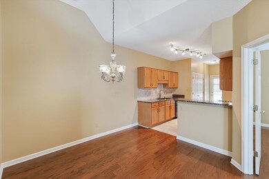 Kitchen features an inviting chandelier and tile f