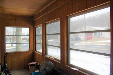 Enclosed front porch.