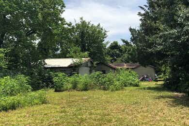 Back of house that is a tear down with garage and priced for lot value only.