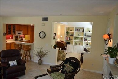The open floor space flows from the living room, b