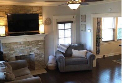 The newly painted living room boasts newer flooring and a  functional stone fireplace.  Great for entertaining or just relaxing and taking in a movie or Steeler game on a lazy Sunday afternoon.