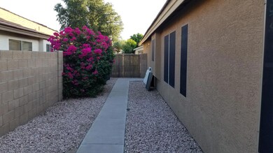 7855 side yard and gate June 2019