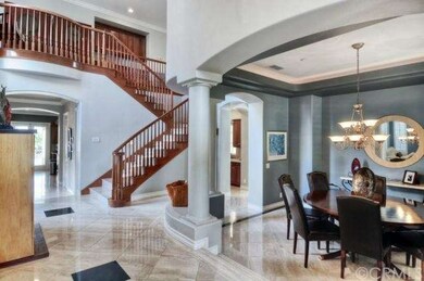 Front Entryway. Travertine Flooring, Formal Dining