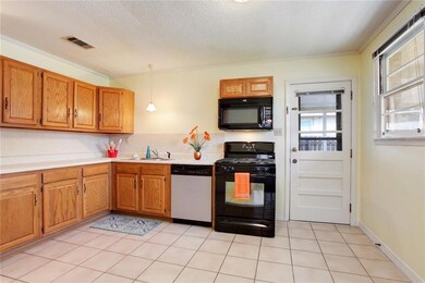 Eat in kitchen with a door to a covered carport