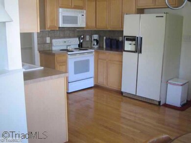 Kitchen. Stove to  be replaced. Kitchen floor now vinyl.