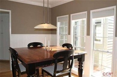 Formal dining room: large light-filled windows and