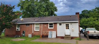 Back of property featuring central air condition u