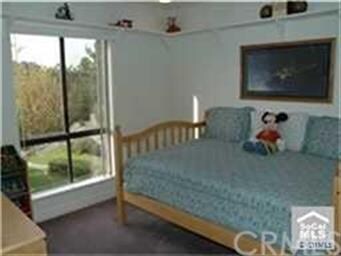 The 2nd BR is appointed w/ a mirrored wardrobe, re