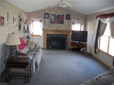 FIRST FLOOR FAMILY ROOM WITH WOOD BURNING FIREPLAC