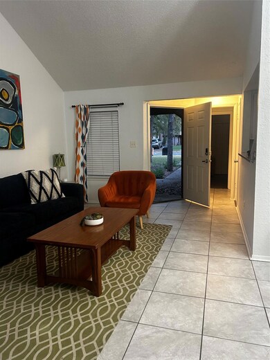 Living area featuring light tile patterned floori