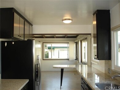 Renovated kitchen with granite & laminate counters
