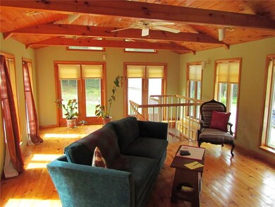 Living Room with stairs in front to spa room.