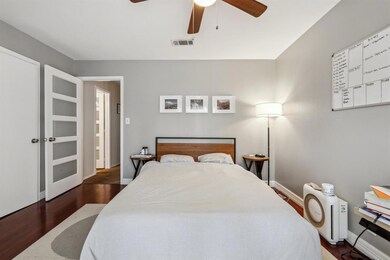 Bedroom featuring wood finished floors, baseboard