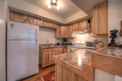 Kitchen with newer cabinets and countertops.