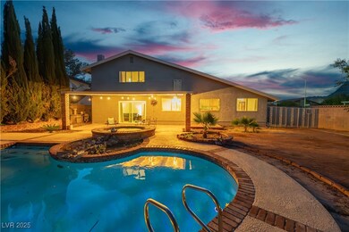 Twilight View of pool/spa featuring fence (dog run