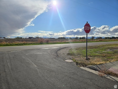 View of asphalt road with traffic signs and a mountain view