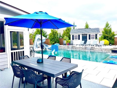 Eating Area outside screened porch next to pool. Entertaining spots GALORE!