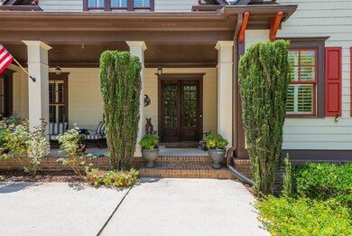 Property entrance featuring a porch and french doors