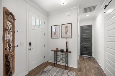 Foyer with the barn door room to you bonus/flex space and Garage