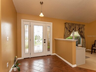 Entry Foyer with upgraded glass door and wood look
