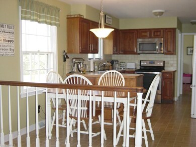 The well-appointed kitchen, which opens to both th