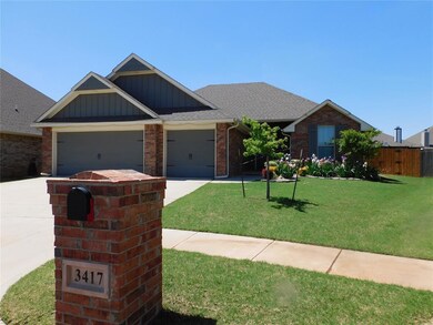 View of front of property with driveway, an attach