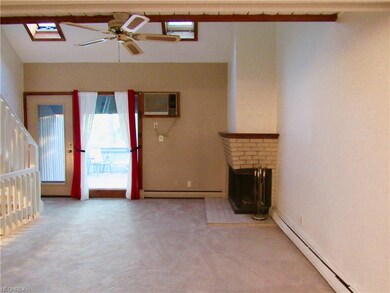Fireplace is wood burning. Glass door leads to dec