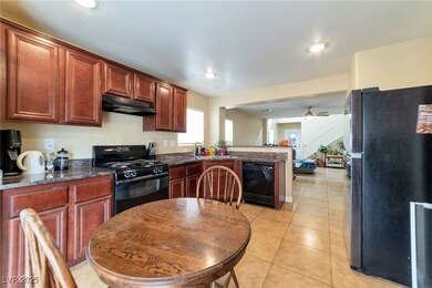 Kitchen featuring ceiling fan, under cabinet range