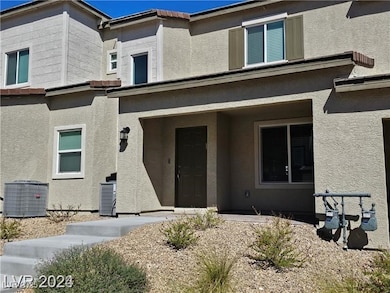 View of exterior entry with stucco siding and a porch