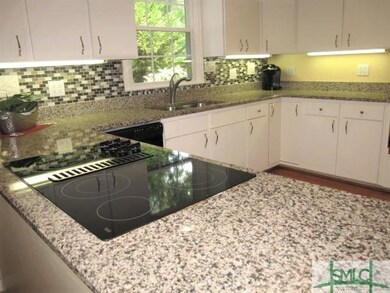 Bright, fully-equipped kitchen with vented, smooth