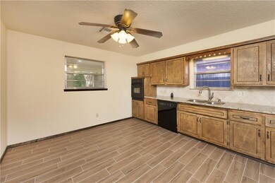 Large open kitchen area has plenty of space for fu
