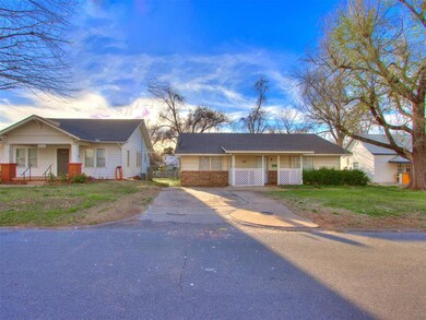 View of front of home with covered porch and a fro
