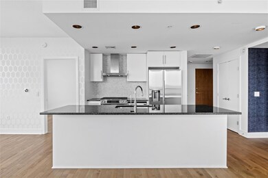 Kitchen with stainless steel appliances, wall chi