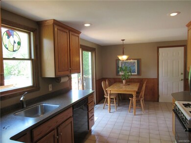 Bright and Cheery Kitchen Opens to Two Tiered Deck