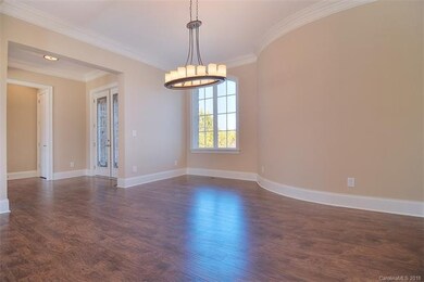 Large Dining Room with curved wall and trim with t