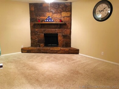 The wood burning fireplace is the focal point of t